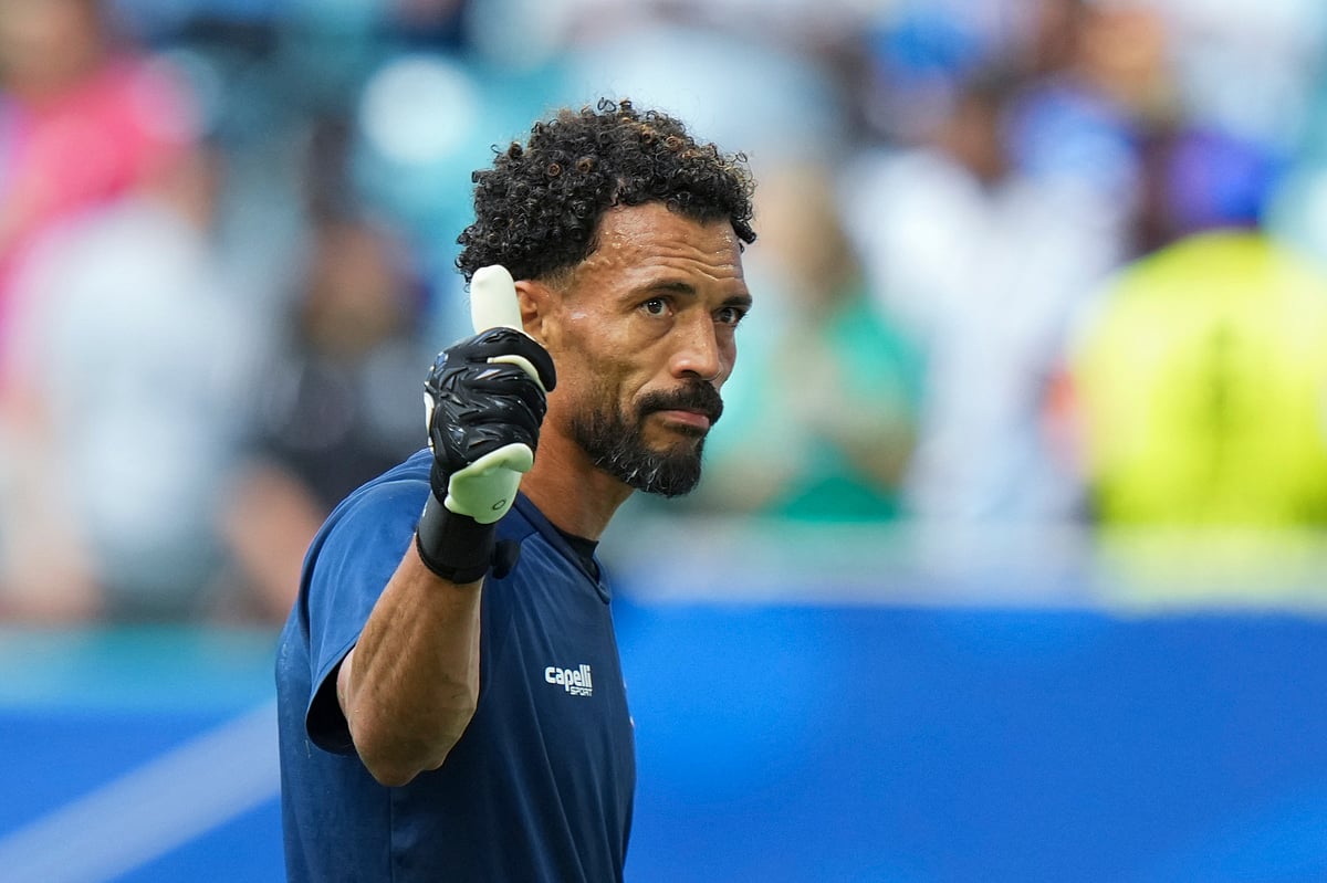 Cape Verde goalkeeper Vozinha waves to fans prior to the World Cup Group H soccer match against Uruguay - AP/Lynne Sladky