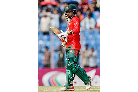 Bangladesh's captain Towhid Hridoy celebrates his fifty runs during the third T20 international cricket match between Australia and Bangladesh, in Chattogram, Bangladesh.