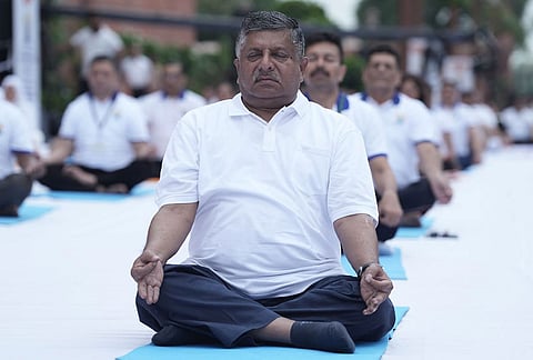 BJP leader Ravi Shankar Prasad performs yoga during a session on the occasion of the International Day of Yoga at the Parliament House complex, in New Delhi.