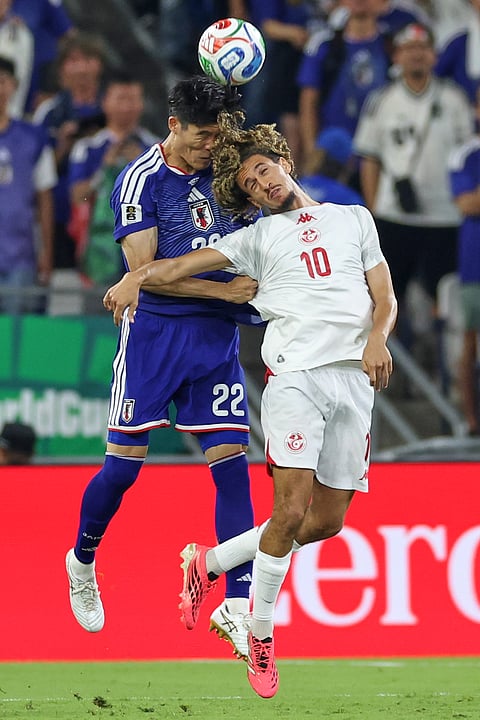 Japan's Takehiro Tomiyasu (22) and Tunisia's Hannibal Mejbri (10) battle for the ball during the World Cup Group F soccer match between Tunisia and Japan in Guadalupe, near Monterrey, Mexico, Saturday, June 20, 2026.