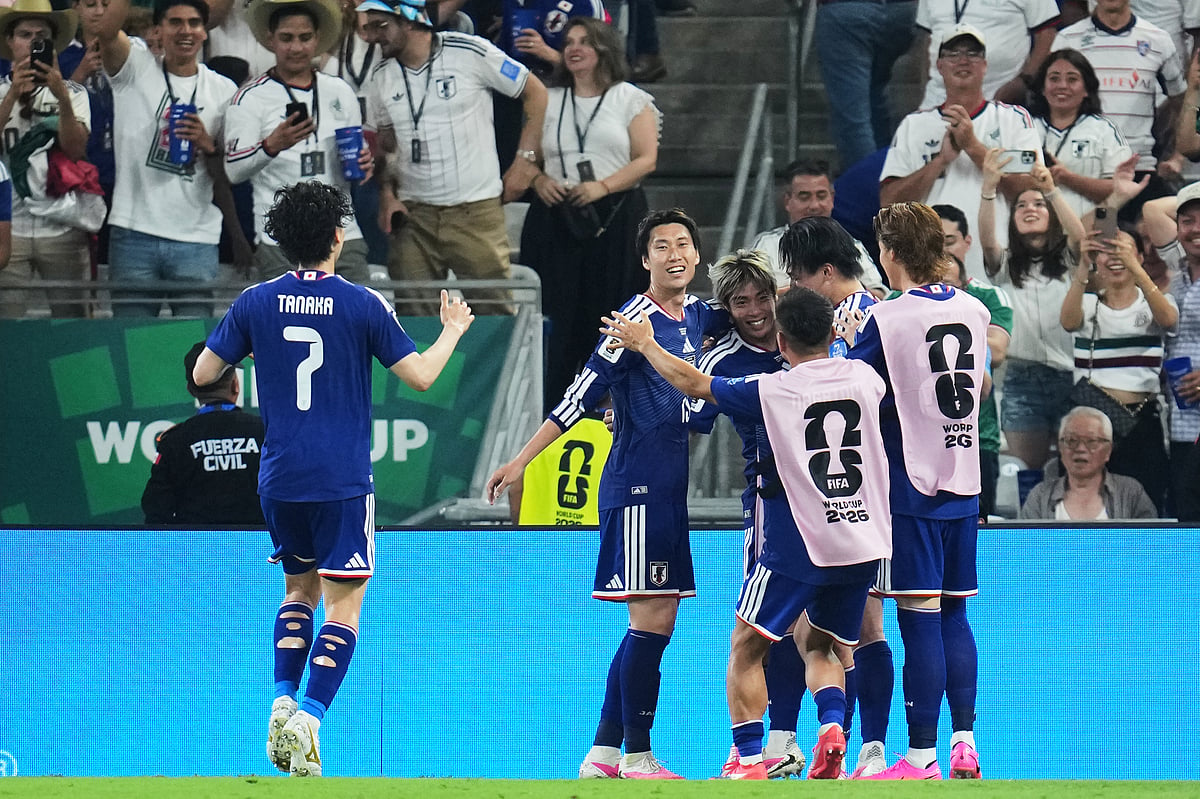 Japan's Junya Ito, center, celebrates with teammates after scoring their third goal against Tunisia during the World Cup Group F soccer match in Guadalupe, near Monterrey, Mexico, Saturday, June 20, 2026. - AP Photo/Matias Delacroix
