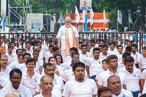 In this image posted on June 21, 2026, Prime Minister Narendra Modi participates in a yoga session during the International Day of Yoga celebrations, in Kolkata.