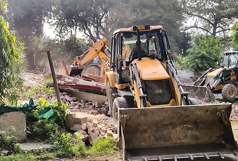 Authorities carry out a demolition drive at the Samajwadi Party office, in Sitapur, Uttar Pradesh. - | Photo: PTI