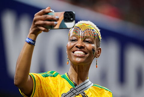 A South Africa fan in the stands shoots pictures before the World Cup Group A soccer match between Czechia and South Africa in Atlanta, Thursday, June 18, 2026. 