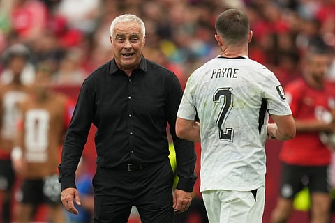 New Zealand head coach Darren Bazeley talks with Tim Payne (2) during the World Cup Group G soccer match between New Zealand and Egypt in Vancouver, British Columbia, Sunday, June 21, 2026