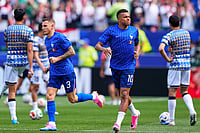 AP/Petr David Josek : France's Kylian Mbappe (10) and teammate Lucas Digne (3) warm up ahead of the World Cup Group I soccer match