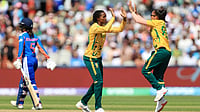 (Nigel French/PA via AP) : South Africa's Ayabonga Khaka (centre) celebrates taking the wicket of India's Yastika Bhatia during the ICC Women's T20 World Cup match between India and South Africa, at Emirates Old Trafford, Manchester, England, Sunday June 21, 2026