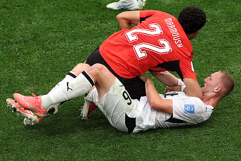 Egypt's Omar Marmoush (22) pushes off of New Zealand's Finn Surman (16) during the World Cup Group G soccer match between New Zealand and Egypt in Vancouver, British Columbia, Sunday, June 21, 2026