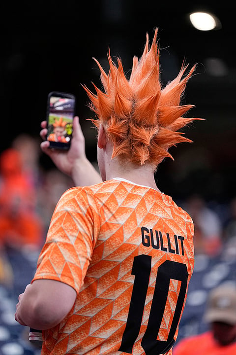 A Netherlands fan, wearing a shirt with the name of former Dutch soccer star Ruud Gullit, takes a selfie on the stands before the World Cup Group F soccer match between the Netherlands and Sweden in Houston, Saturday, June 20, 2026.  