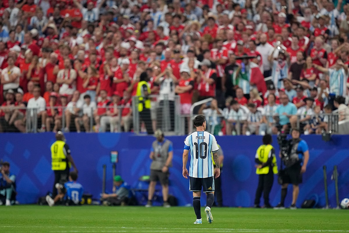 AP : Argentinas Lionel Messi (10) walks on the pitch after scoring the opening goal of his team