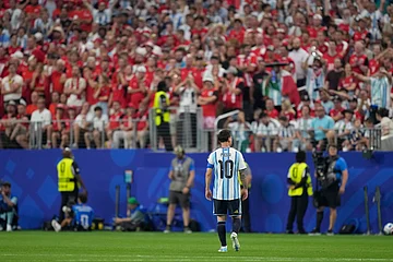 AP : Argentina's Lionel Messi (10) walks on the pitch after scoring the opening goal of his team