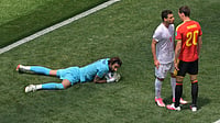 AP/Jayne Kamin-Oncea : Iran's Shoja Khalilzadeh (4) and Belgium's Hans Vanaken (20) echenche words during the World Cup Group G soccer match