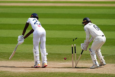 England's Jofra Archer, left, is bowled out by New Zealand's Matt Henry on day five  of the Second Rothesay Test cricket match between England and New Zealand in London, England.