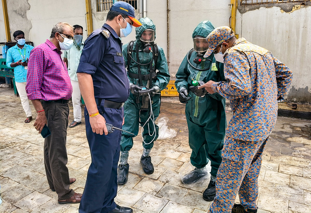 National Disaster Response Force (NDRF) personnel arrive at a seafood export unit following an ammonia gas leak, in Manjangaranai, Thiruvallur district, Tamil Nadu, Sunday, June 21, 2026. - PTI