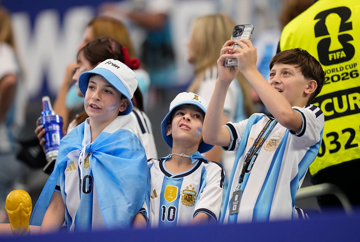Young fans wait for the start of the World Cup Group J soccer match between Argentina and Austria in Arlington, Texas, near Dallas, Monday. - AP