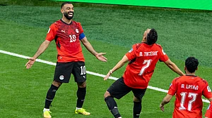 (Timothy Matwey/The Canadian Press via AP : Egypt’s Trezeguet (7) celebrates his goal against New Zealand with teammate Mohamed Salah (10) during the World Cup Group G soccer match between New Zealand and Egypt in Vancouver, British Columbia, Sunday, June 21, 2026