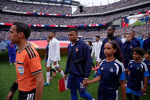 Players enters to the pitch prior to the World Cup Group I soccer match between France and Iraq in Philadelphia