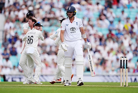 England's Josh Tongue reacts after being bowled out by New Zealand's Matt Henry on day five  of the Second Rothesay Test cricket match between England and New Zealand in London, England.