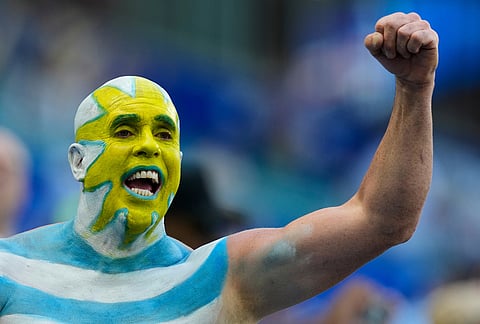 An Uruguay fan cheers ahead of the World Cup Group H soccer match between Uruguay and Cape Verde in Miami Gardens, Fla., Sunday, June 21, 2026.