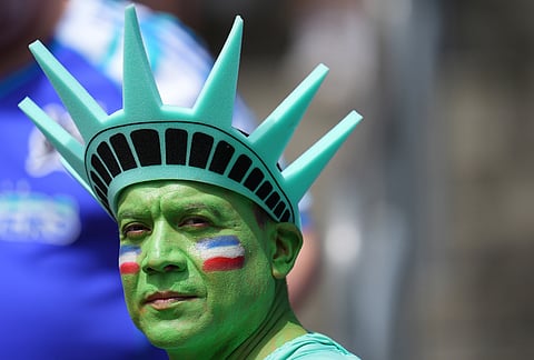 A fan waits for the start of the World Cup Group D soccer match between the United States and Australia in Seattle, Friday, June 19, 2026. 