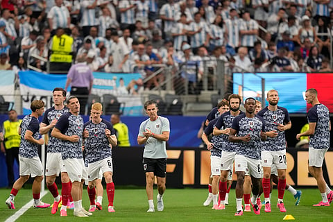 Austria players warm up before the World Cup Group J soccer match between Argentina and Austria in Arlington