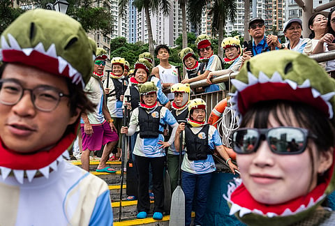 Competitors in costumes take part in the Aberdeen Dragon Boat Race to celebrate the Dragon Boat Festival in Hong Kong.