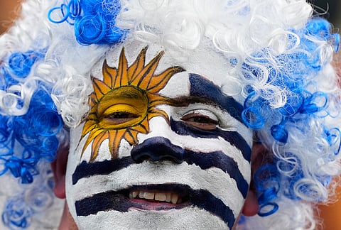 A fan of Uruguay smiles prior to the World Cup Group H soccer match between Saudi Arabia and Uruguay in Miami Gardens, Fla., Monday, June 15, 2026. 