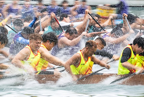 Competitors take part in the Aberdeen Dragon Boat Race to celebrate the Dragon Boat Festival in Hong Kong.