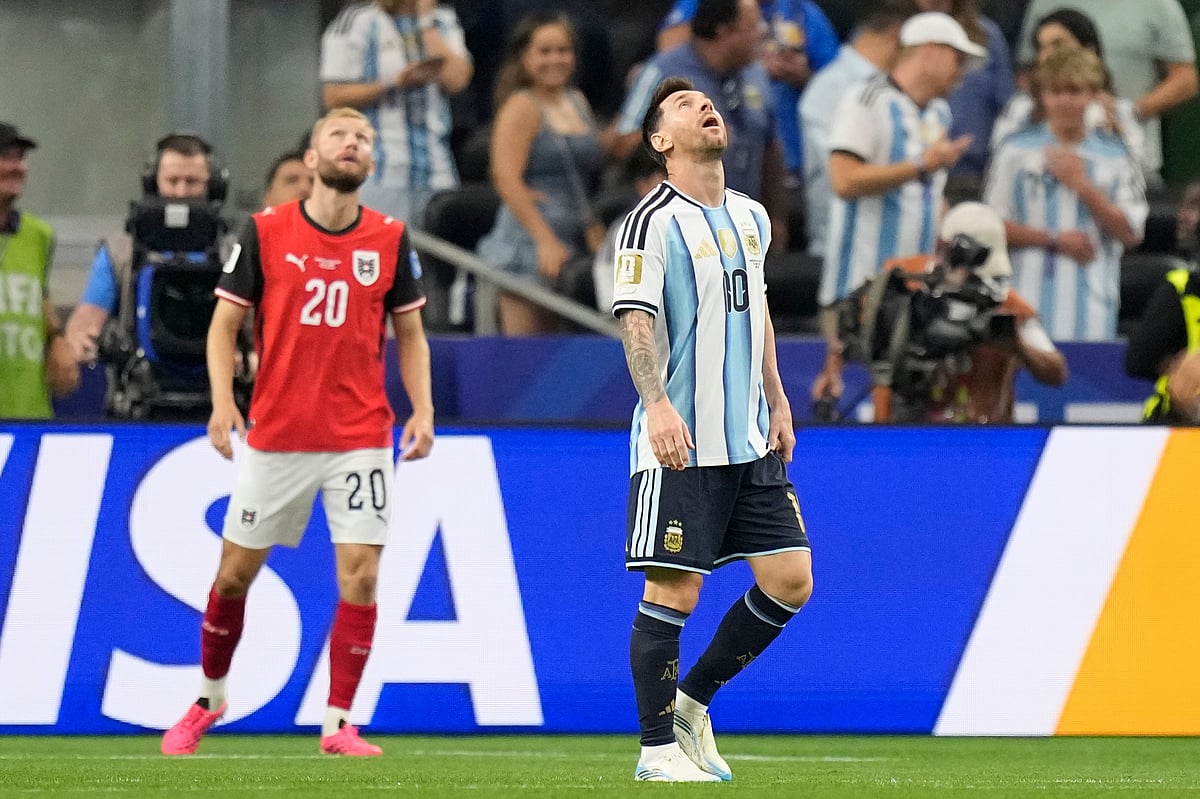 Argentina's Lionel Messi (10) reacts after failed to score a penalty kick during the World Cup Group J soccer match. - AP
