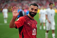 (Darryl Dyck/The Canadian Press via AP) : Egypt's Mohamed Salah (10) smiles and waves to fans as he leaves the field following the team's victory in the World Cup Group G soccer match between New Zealand and Egypt in Vancouver, British Columbia, Sunday, June 21, 2026