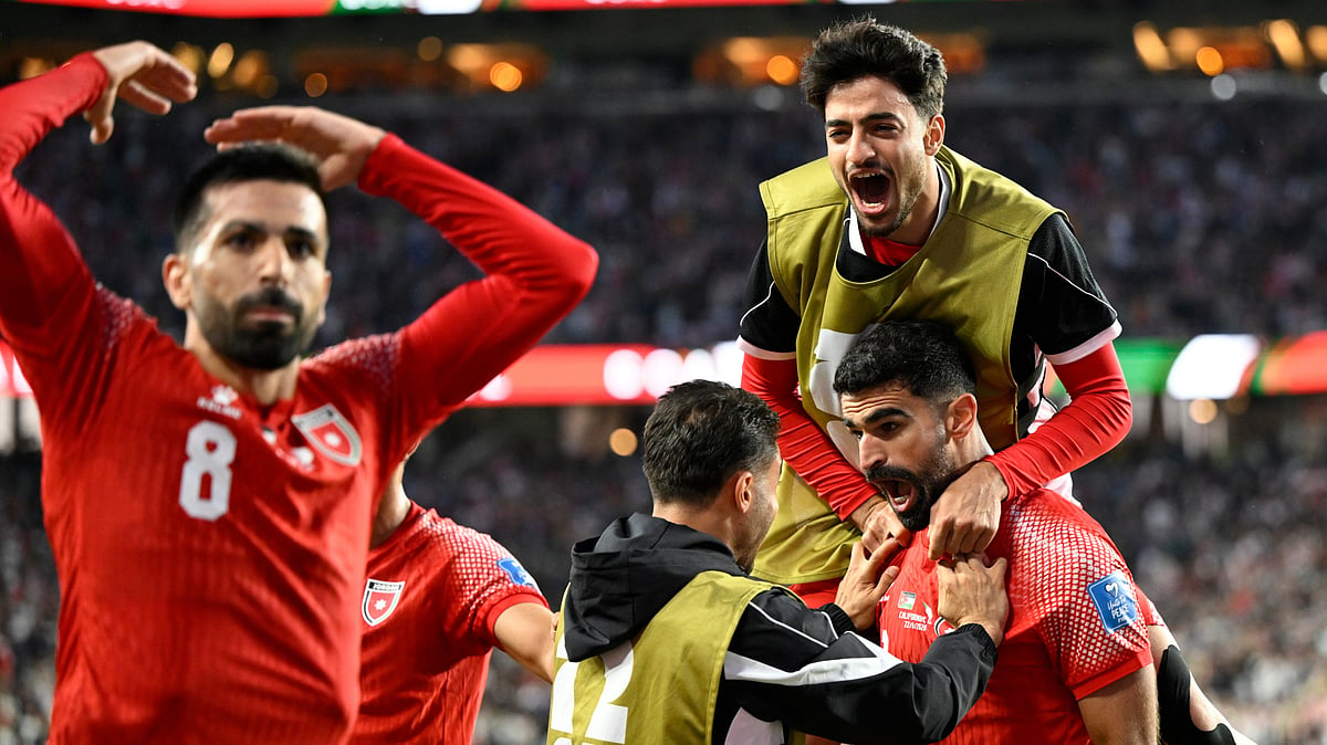 Jordan's Nizar Alrashdan, bottom right, is congratulated by his teammates after he scoring the opening goal against Algeria during the World Cup Group J soccer match in Santa Clara, Calif., near San Francisco, Monday, June 22, 2026 - (AP Photo/Eakin Howard)