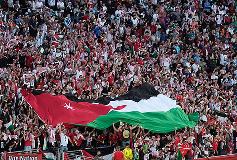 A large Jordanian flag is seen during the World Cup Group J soccer match between Jordan and Algeria in Santa Clara, Calif., near San Francisco.