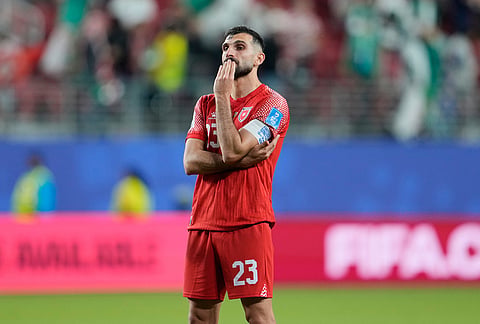 Jordan's Ehsan Haddad (23) reacts after their loss in the World Cup Group J soccer match between Jordan and Algeria in Santa Clara, Calif., near San Francisco.