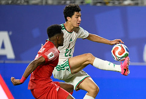 Algeria's Ibrahim Maza, back, controls the ball chased by Jordan's Abdallah Nasib during the World Cup Group J soccer match in Santa Clara, Calif., near San Francisco.