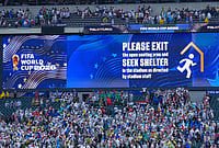 When Nature Stopped Time: Inside The 130-Minute Storm Delay In Philly | Photo: AP/Petr David Josek : A sign is shown advising fans to exit seating as a severe weather storm hits during the World Cup Group I soccer match between France and Iraq in Philadelphia.