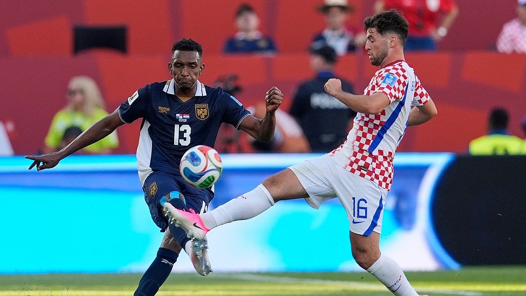 Panama's Jiovany Ramos (13) and Croatia's Martin Baturina (16) compete for the ball during the World Cup Group L soccer match between Panama and Croatia in Toronto. - Olivia White/AP Photo