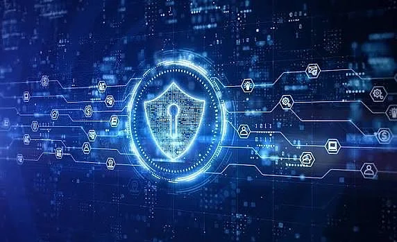 Glowing digital shield on a blue circuit background