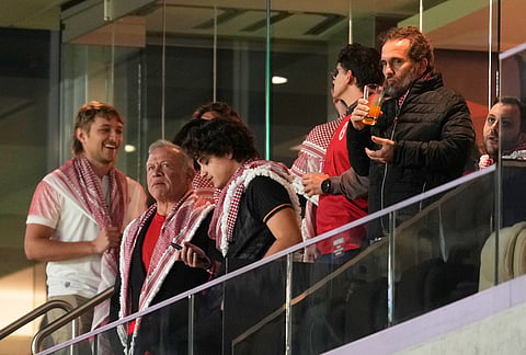 Jordan's King Abdullah II, second from left, attends the World Cup Group J soccer match between Jordan and Algeria in Santa Clara, Calif., near San Francisco.