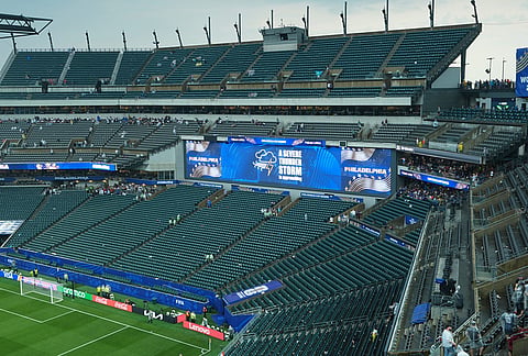 A sign is shown advising fans to exit seating as a severe weather storm hits during the World Cup Group I soccer match between France and Iraq in Philadelphia.