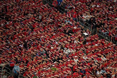 Norway fans perform a rowing ritual during the World Cup Group I soccer match between Norway and Senegal in East Rutherford, N.J., near New York, Monday