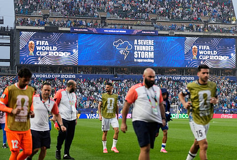 Fans are warned to seek shelter from approaching thunder storm during the World Cup Group I soccer match between France and Iraq in Philadelphia.