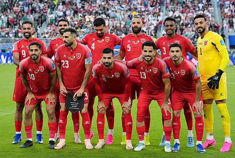 Jordan players pose for a team photo before the start of the World Cup Group J soccer match between Jordan and Algeria in Santa Clara, Calif., near San Francisco.
