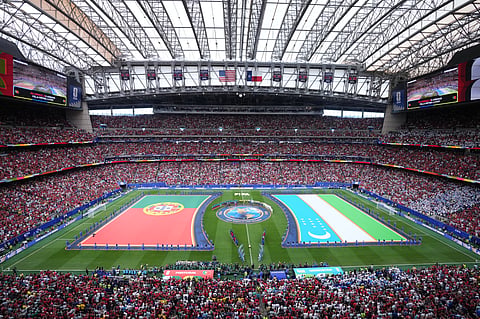 Flags for Portugal and Uzbekistan are displayed ahead of the World Cup Group K soccer match between Portugal and Uzbekistan.