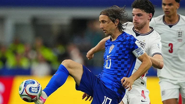 Luka Modric (10) the captain of Croatia controlling the ball and Declan Rice (4) trying to take possession - AP Photo