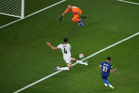 France's Kylian Mbappe (10) scores his side's second goal during the World Cup Group I soccer match between France and Iraq in Philadelphia.