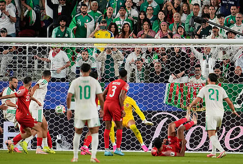 Algeria's Amine Gouiri (9) scores his side's second goal during the World Cup Group J soccer match between Jordan and Algeria in Santa Clara, Calif., near San Francisco.