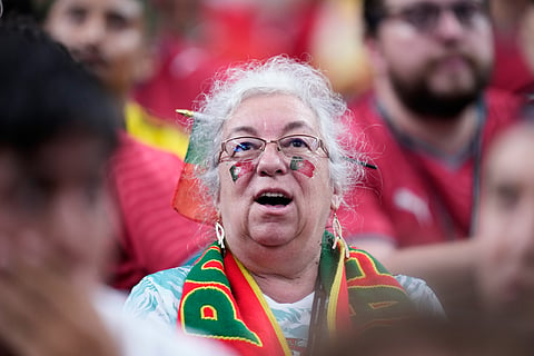 Fans of Portugal cheer before the kickoff the World Cup Group K soccer match between Portugal and Uzbekistan in Houston