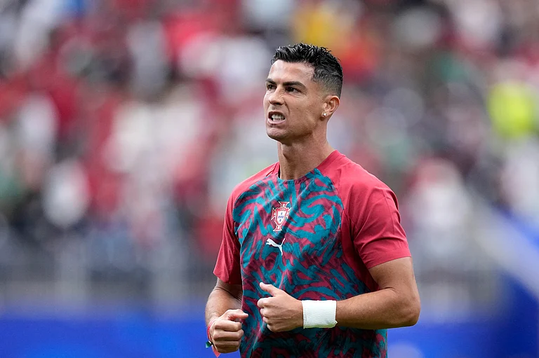 Portugal's Cristiano Ronaldo during warmup before the World Cup Group K soccer match between Portugal and Uzbekistan - AP/Ashley Landis