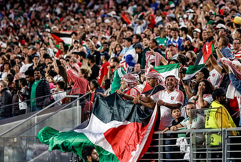 Jordan fans celebrate their team's goal during the World Cup Group J soccer match between Jordan and Algeria in Santa Clara, Calif., near San Francisco.