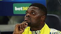 Beyond the Pitch: The Thomas Partey Controversy At The FIFA World Cup 2026 Ian Walton/AP Photo : Villarreal's Thomas Partey sits on the bench during the Champions League soccer match between Tottenham and Villarreal in London.